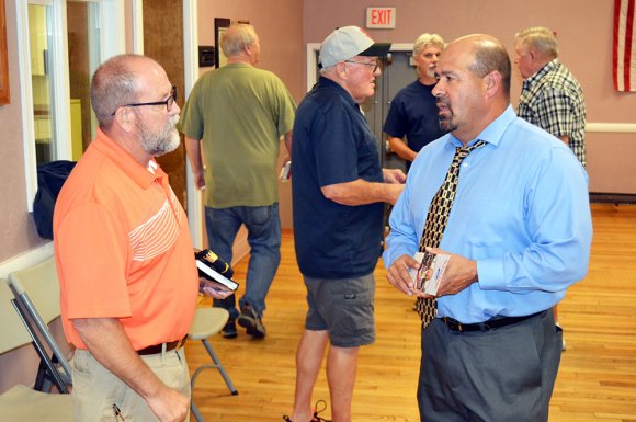 Lemoore Mayor Ray Madrigal chats with Lemoore resident Jerry Welsh after Wednesday night's forum sponsored by the Lemoore American Legion Post 100.